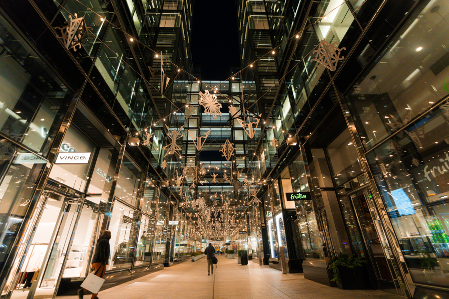 Bright alley with lights and shops